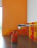 <p>Nelson home feature walls are painted Dulux Evans Bay, a tangerine present in the hand glazed tiled splashback. </p>